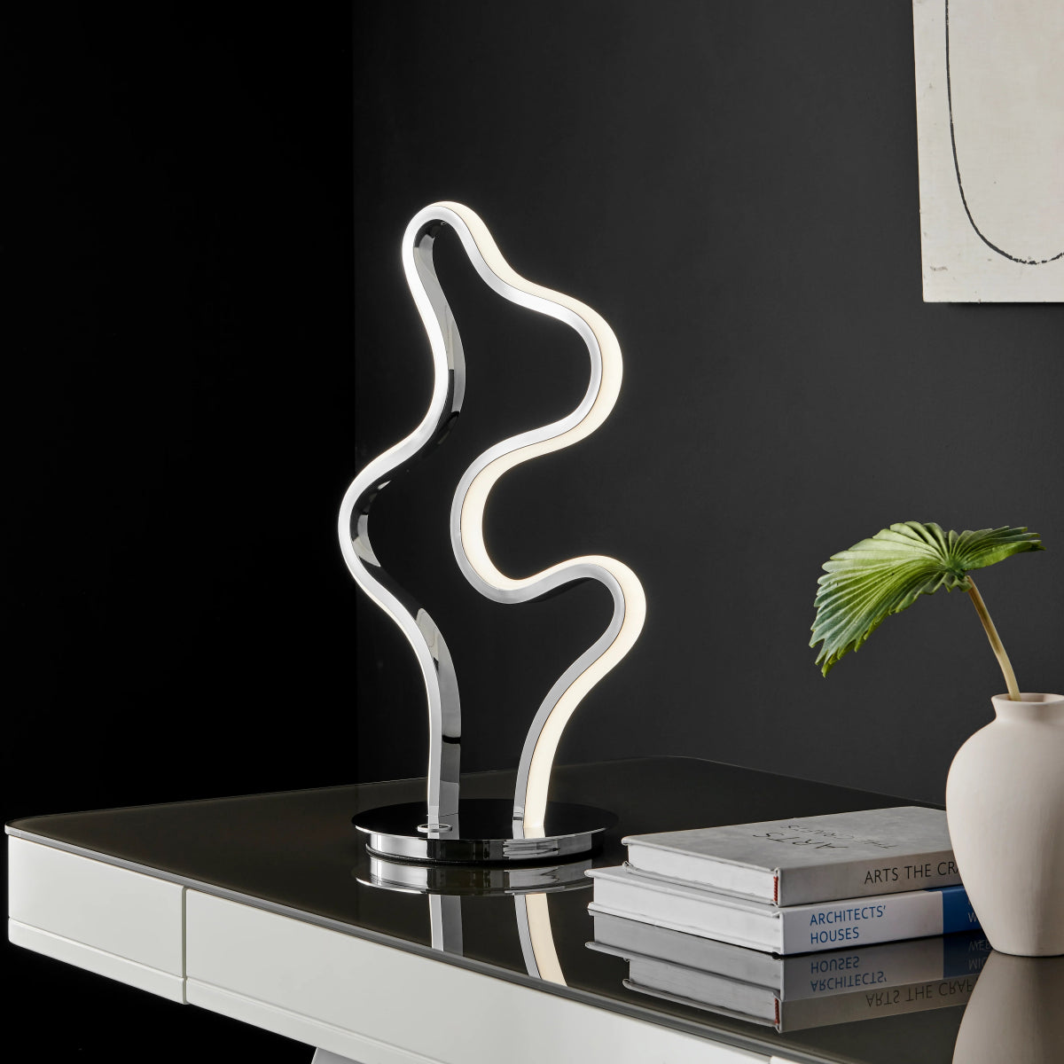 This modern table lamp is stylish and will complement your living space.